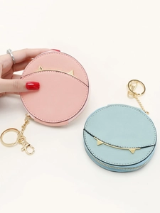 Mini round cat-ear coin purses in pink and blue with gold keyrings and zip closure