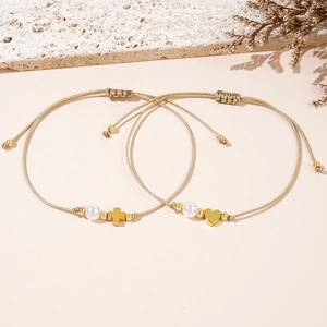 Set of two handmade champagne braided rope bracelets with gold cross and heart charms