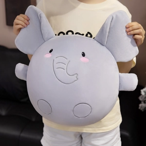 Soft gray elephant plush pillow with embroidered details held by a model for home decor