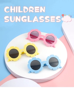 Three pairs of cute flower-shaped children sunglasses in pink yellow and blue colors