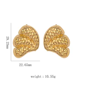 Detailed view of large gold quilted heart stud earrings with exact size measurements