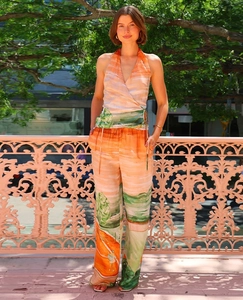 Detail of floral print halter top and wide leg pants set for a stylish vacation look