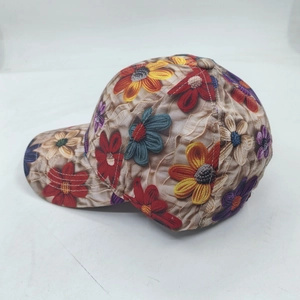 Floral print baseball cap with colorful daisies and textured fabric for women