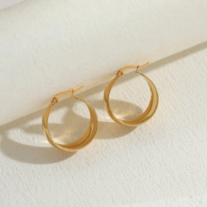 Chic gold-plated titanium steel geometric hoop earrings for women on minimalist podium
