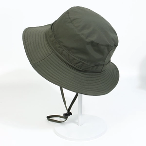 Detail of army green bucket hat with wide brim and adjustable windproof drawstring