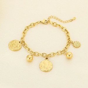 Detail of 18K gold-plated bracelet with sun, moon, and star bohemian celestial charms