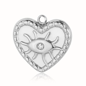 Macro shot of silver heart evil eye pendant with crystal inlay and beaded edge details