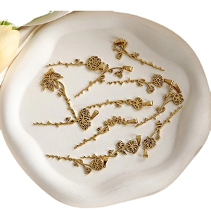 Gold stainless steel birth flower pendant necklace collection with script lettering detail
