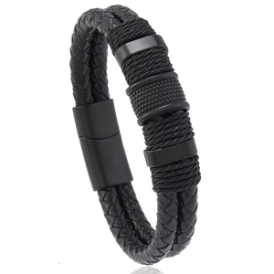 Close-up of double-layered black braided leather bracelet with magnetic metal clasp