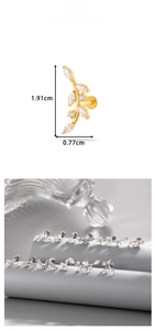 Detailed view of gold leaf stud earring with clear zircon inlay and precise dimensions