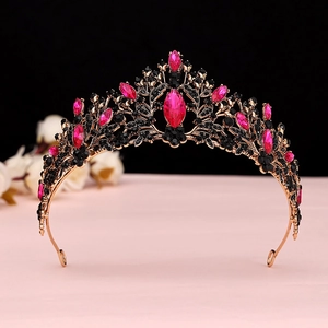 Close-up of Baroque crown featuring rose pink crystals and vintage gold alloy base