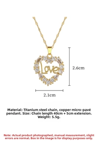 Macro detail of gold titanium heart necklace with micro-pave zircons and Love engraving