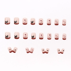 French retro style press-on nails with red gradient, butterfly, and rose patterns