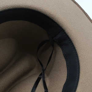 Detail of wool fedora interior featuring black ribbed sweatband and adjustable drawstring