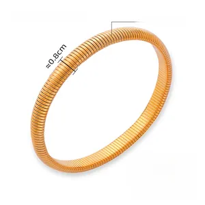 Detailed macro view showing the 0.8cm width and 14g weight of the gold titanium cuff