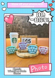 Mini whack-a-mole game keychains in mint, purple, blue, and pink with hamster design
