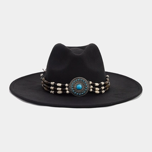 Detail of bohemian beaded band with turquoise stone on black wide brim fedora hat