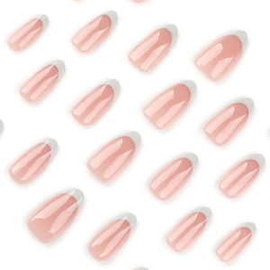 French white almond press-on nails with glossy nude base and white tips on white background