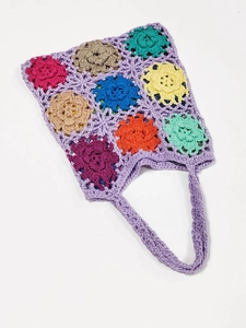 Detailed close-up of handmade crochet tote bag featuring colorful sunflower patterns