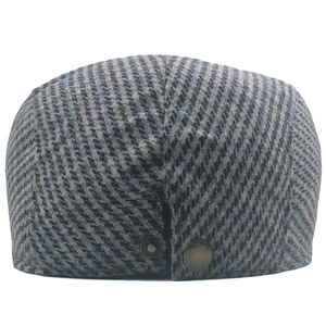 Detailed back view of wool tweed newsboy cap with houndstooth pattern and bronze buckles