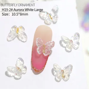 Macro view of 10.5x8mm Aurora White resin butterfly charms for 3D nail art decoration