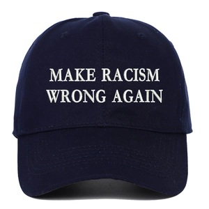 Detailed close-up of white Make Racism Wrong Again embroidery on a navy cotton baseball cap