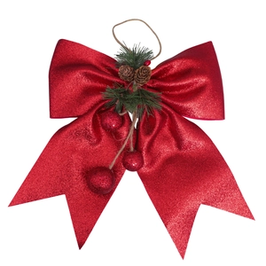 Large red glitter Christmas bow with natural pine cones and green needles decor