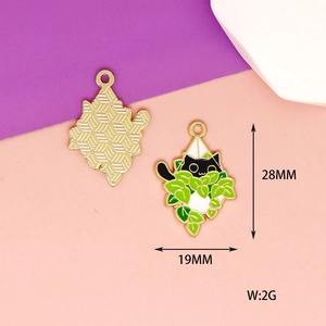 Detail of 28mm x 19mm black cat in green plant enamel charms with gold textured backing
