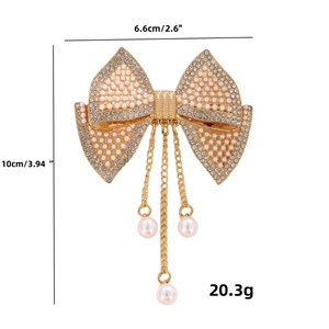 Bow hair clip with white pearls and rhinestones on gold metal base with size details
