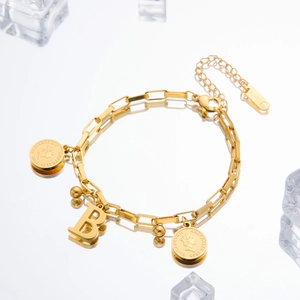 Detail showing letter B and Elizabeth II coin charms on a gold stainless steel chain