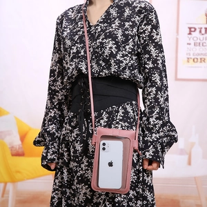 Pink leather touchscreen crossbody phone bag with transparent window and shoulder strap