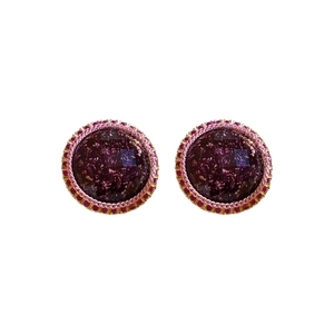 Deep purple resin stud earrings with gold foil and crystal border on white background