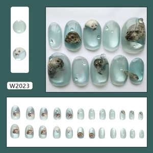 Cat eye light blue press on nails with 3D bubble texture and cute seal patterns