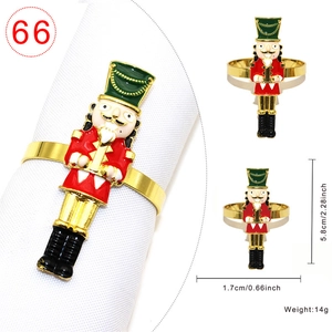 Christmas nutcracker napkin ring in red and green enamel finish with golden trim