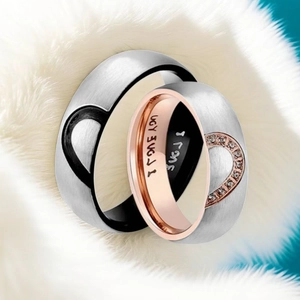 Couples heart titanium steel rings set with I LOVE YOU engraving on faux fur background