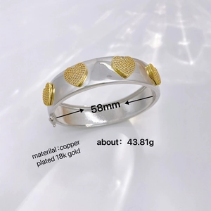 Silver copper bangle with gold inlaid heart charms and sparkling zircon diamonds