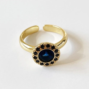 Elegant S925 silver gold-plated ring featuring a deep blue stone with black halo stones