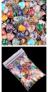 Bulk natural heart stone pendants with gold metal frames and clear plastic packaging