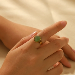 French vintage 18K gold plated stainless steel ring with oval green gemstone on hand