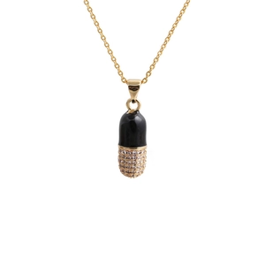 Gold pill pendant necklace with black enamel and sparkling cubic zirconia stones