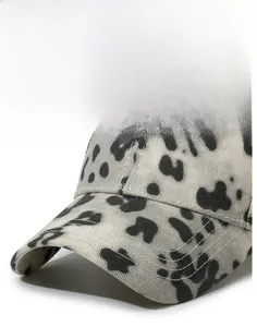 Detailed close-up of leopard print baseball cap brim with precise stitching lines
