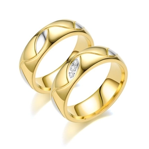 Detailed close-up of 18K gold and silver plated couple rings with inlaid diamonds