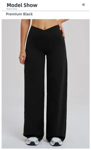 Détail de la taille haute en V sur le pantalon de sport large noir brossé haut de gamme