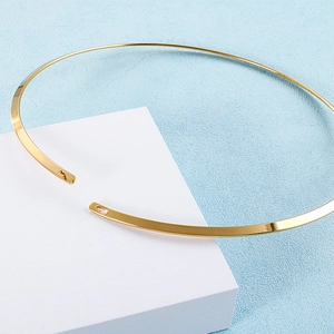 Minimalist 4mm gold titanium steel rigid choker necklace on a white display block