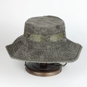 Detail of wide brim sun hat featuring breathable mesh band and washed cotton fabric