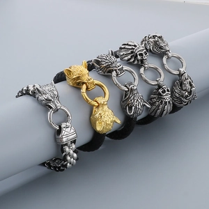 Detailed collection of black braided leather bracelets with Viking wolf and skull charms