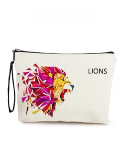 Detail of lion graphic printed on canvas cosmetic bag with zipper and hand strap