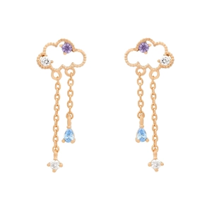 Detail of cloud-shaped gold earrings with purple gemstones and blue teardrop tassels