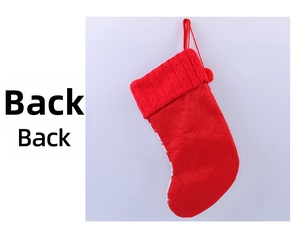 Detail view showing back of red knitted Christmas stocking with cable knit texture