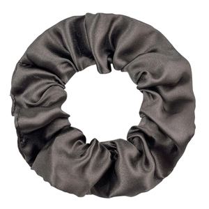 Macro view of dark charcoal grey satin scrunchie showing fine fabric texture and sheen